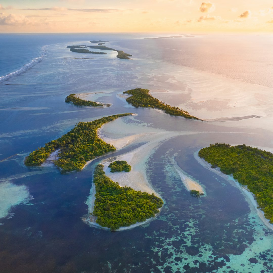 Airplane view flying over tropical islands