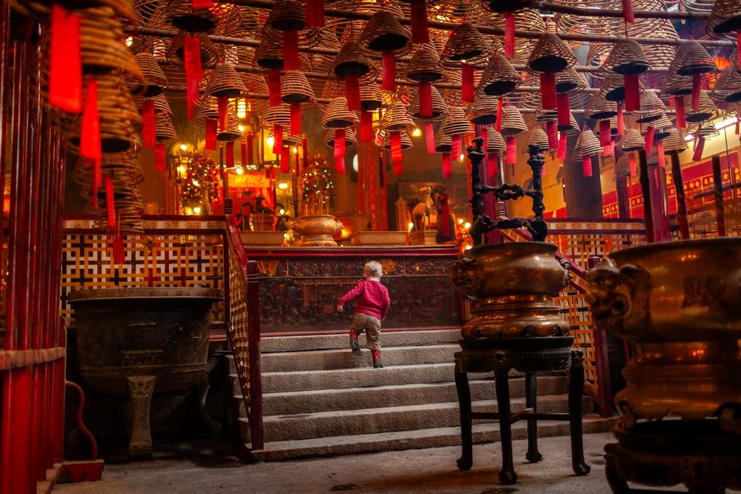 Wong Tai Sin Temple in Hong Kong with traditional architecture and incense coils